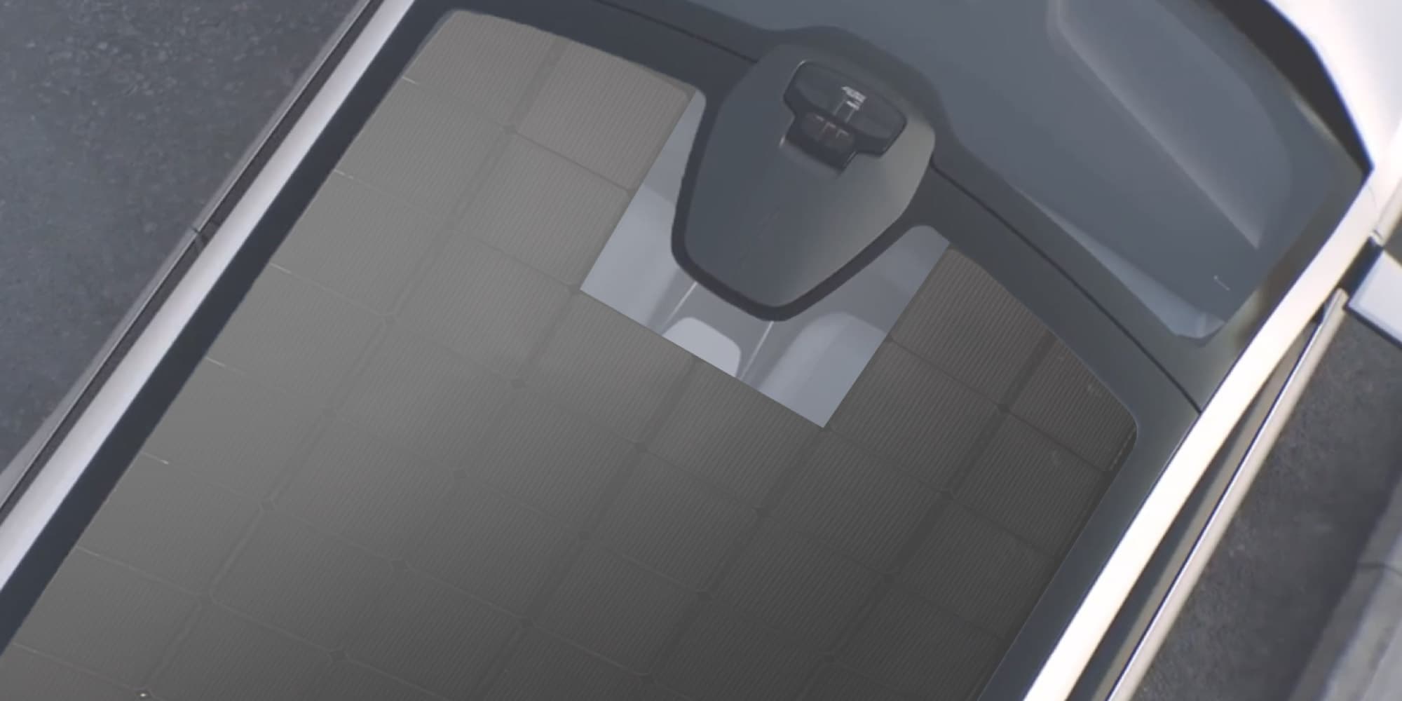sundrive Close-up of a solar panel integrated into a vehicle roof with a central camera or sensor module.