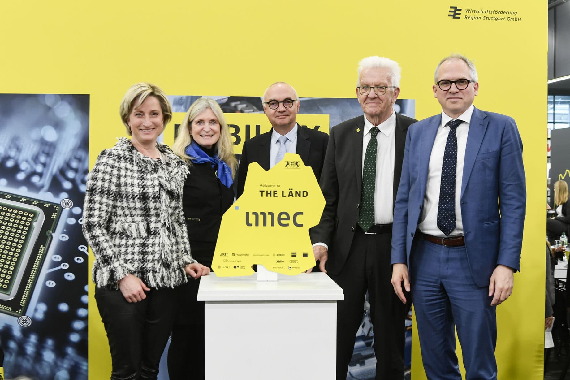imec-germany-hannover-launch Five officials pose with an imec sign at a Germany launch event.