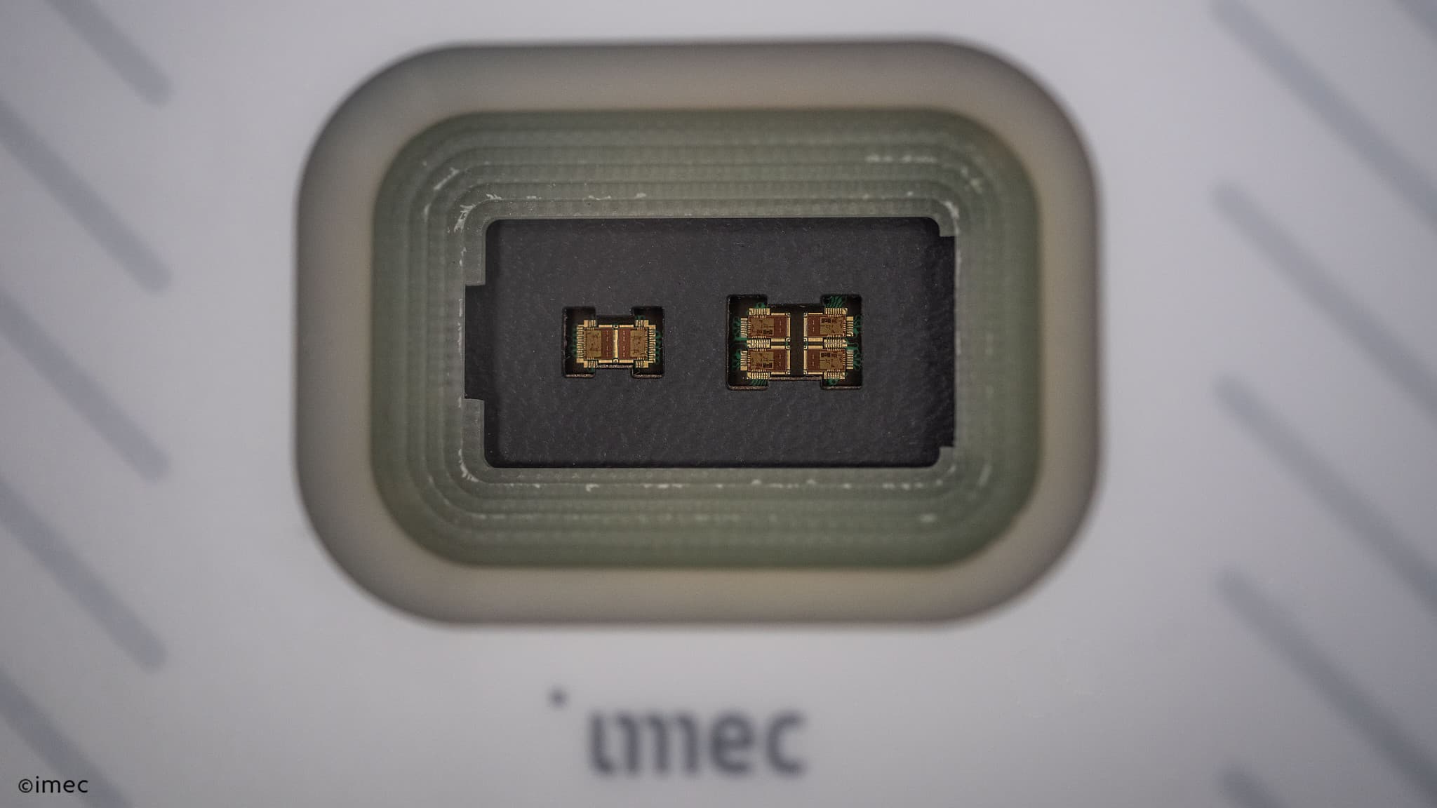 140%20GHz%20radar%20chip Microscopic view of a radar chip with two tiny circuit dies in a rectangular package