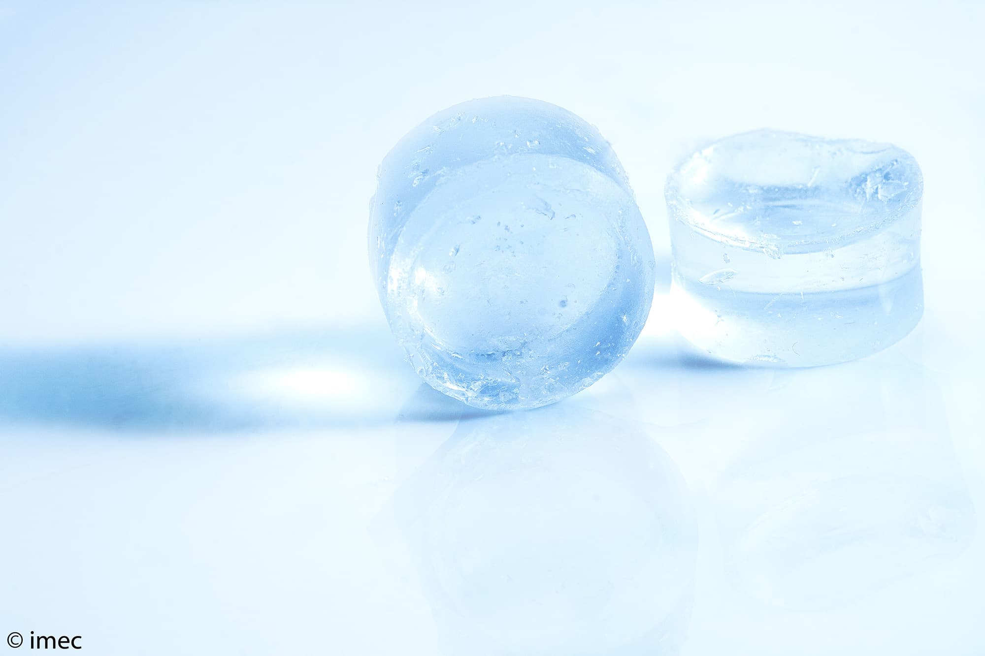 Blue translucent solid-state battery cells Blue translucent solid-state battery cells on a bright reflective surface