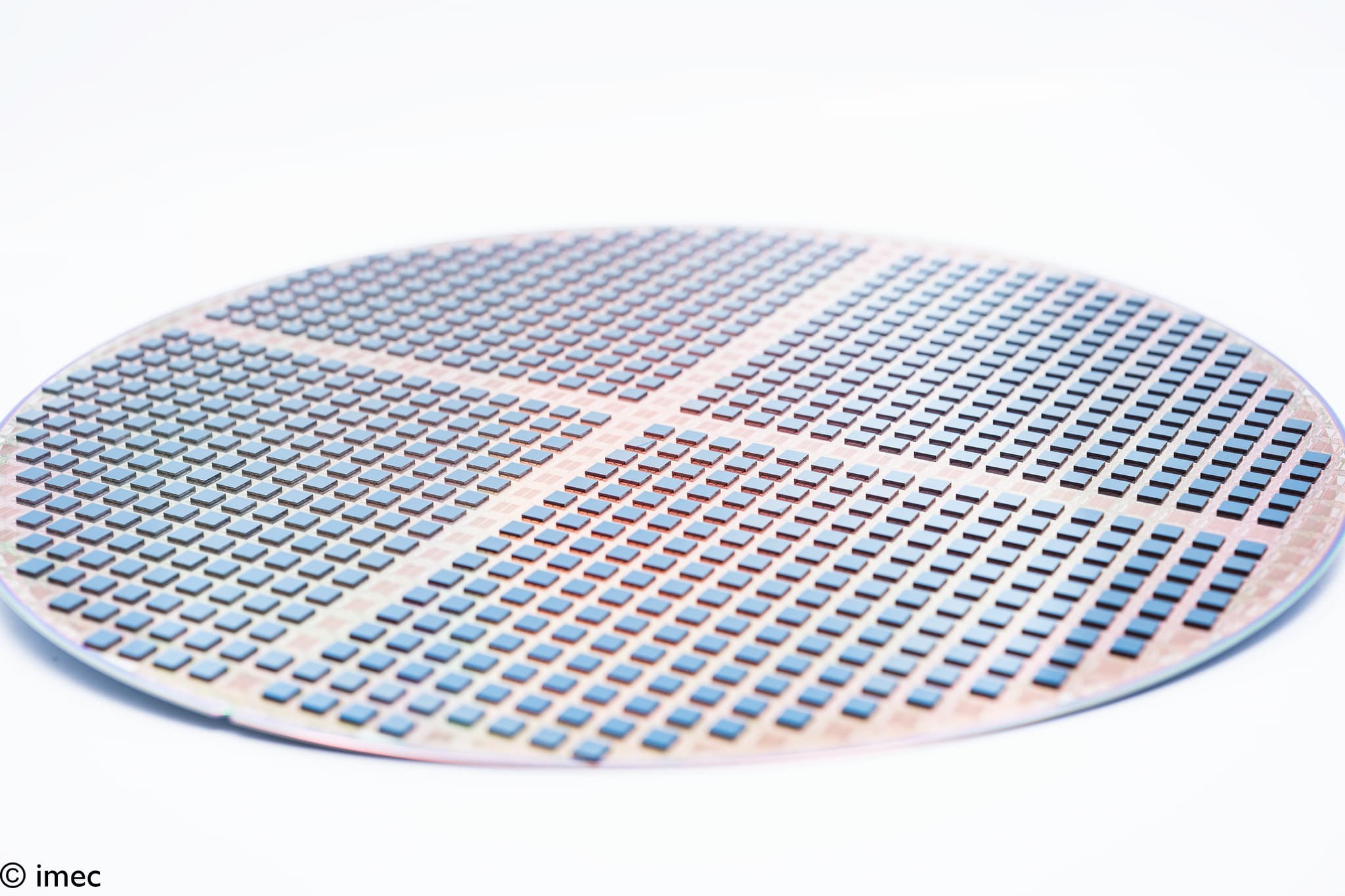 Silicon wafer with many small blue square dies Silicon wafer covered with many small blue square dies for 3D integration
