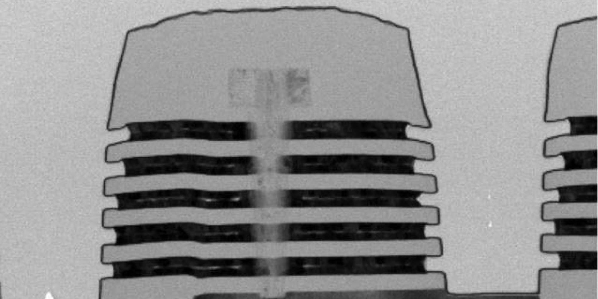 3DNAND Black-and-white close-up of a stacked 3D NAND memory structure diagram