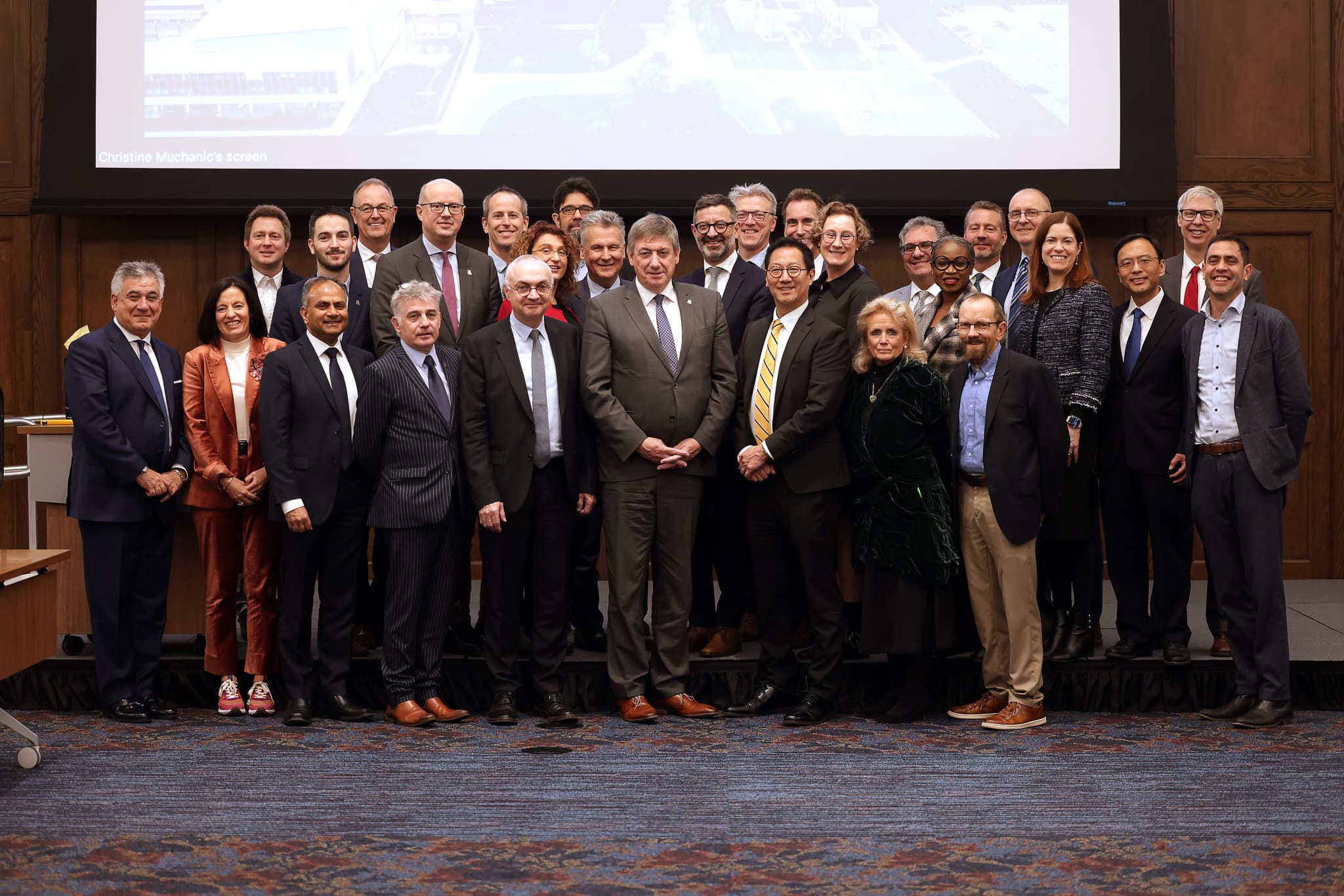 53386955590_609adae550_k Group of officials and researchers posing for a formal team photo in a conference room