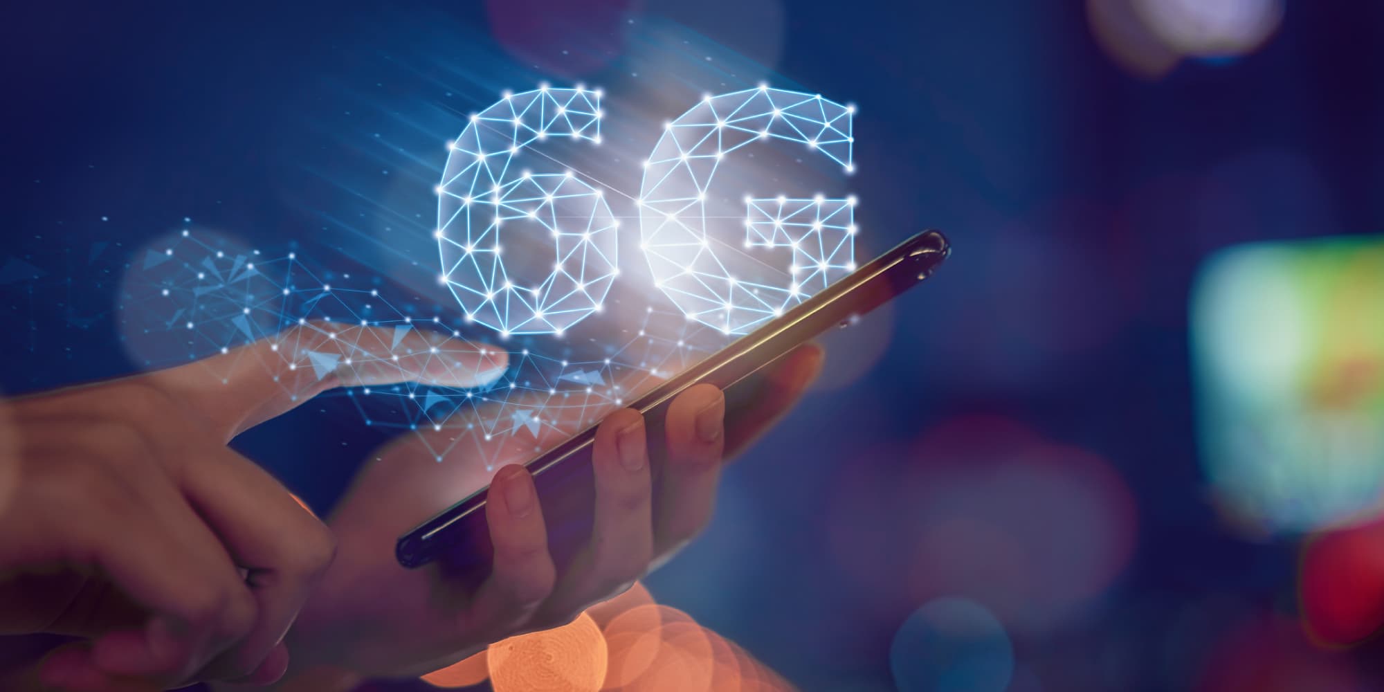 6G Hands holding a smartphone with a glowing 6G graphic overlay