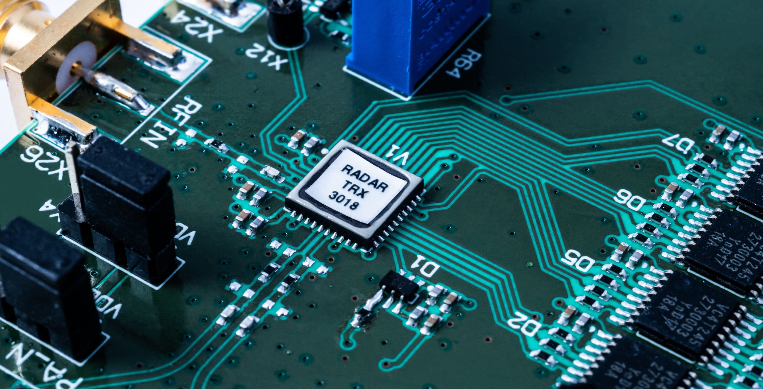 8ghz_uwb_radar_final_1 Close-up of a radar circuit board with a central chip labeled RADAR TRX 3018 and copper traces