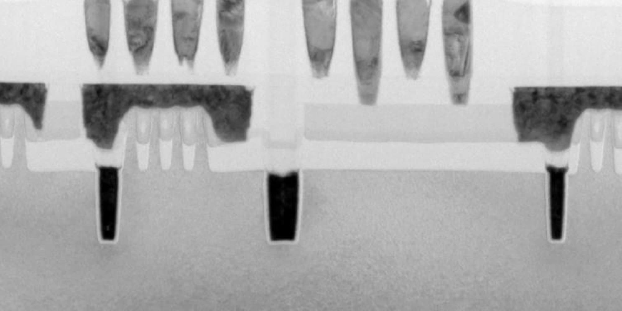 A-view-on-the-logic-technology-roadmap Cross-section view of a logic chip structure with layered fins and metal interconnects