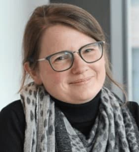 An%20Coosemans Portrait of An Coosemans wearing glasses and a patterned scarf