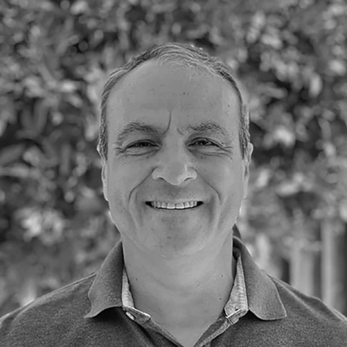 andres-bw Portrait of Andres Fernandez smiling outdoors