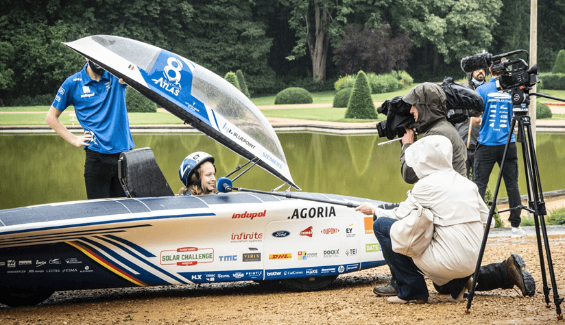 BluePoint%20Atlas_a BluePoint Atlas solar race car being filmed and photographed in a park beside a pond