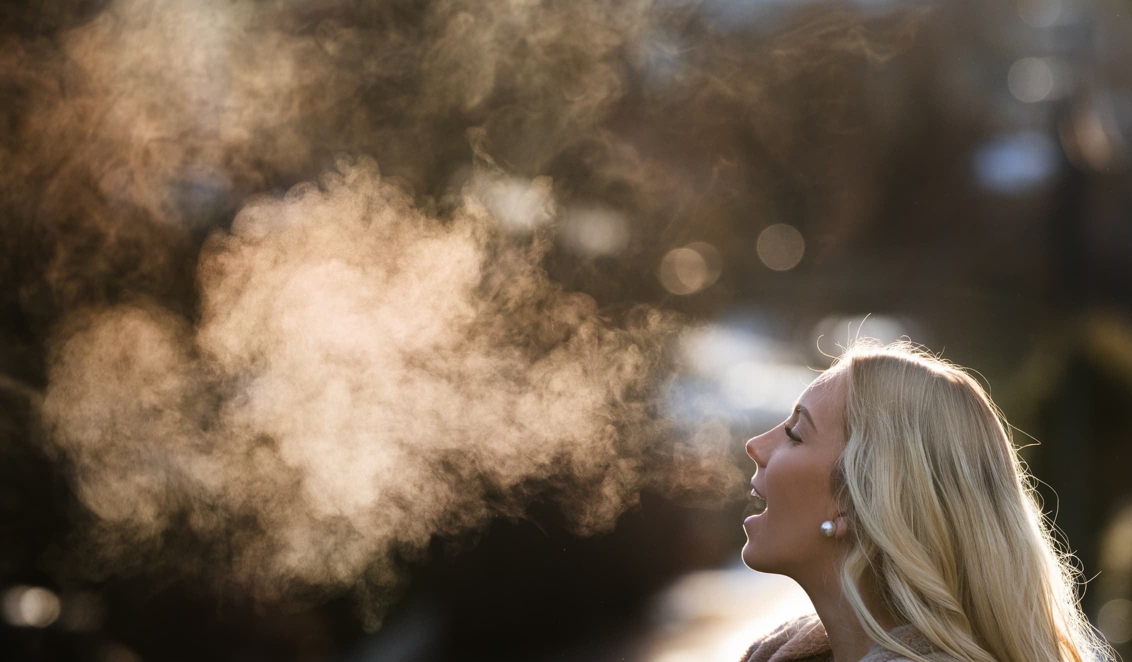 Breath%20sampler Woman exhaling visible breath in cold air