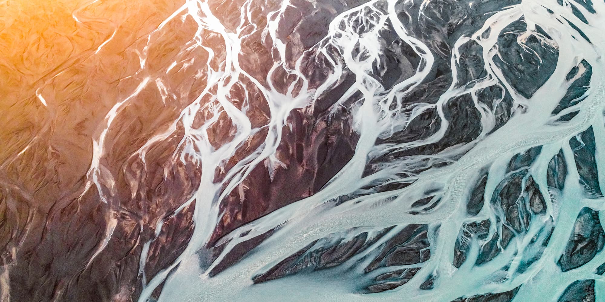 chipcooler3_1 Aerial view of branching white river channels across dark terrain, suggesting cooling flow patterns