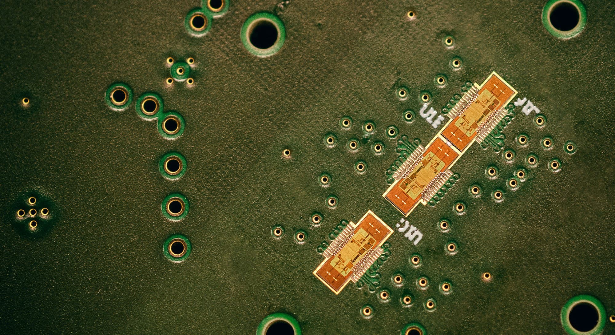 compacthigh_resolution40ghz_radar_with_onchip_attenas_1 Green circuit board with three small radar chip modules and many plated via holes