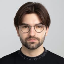 Constantin-Scholz Portrait of Constantin Scholz wearing glasses and a dark sweater