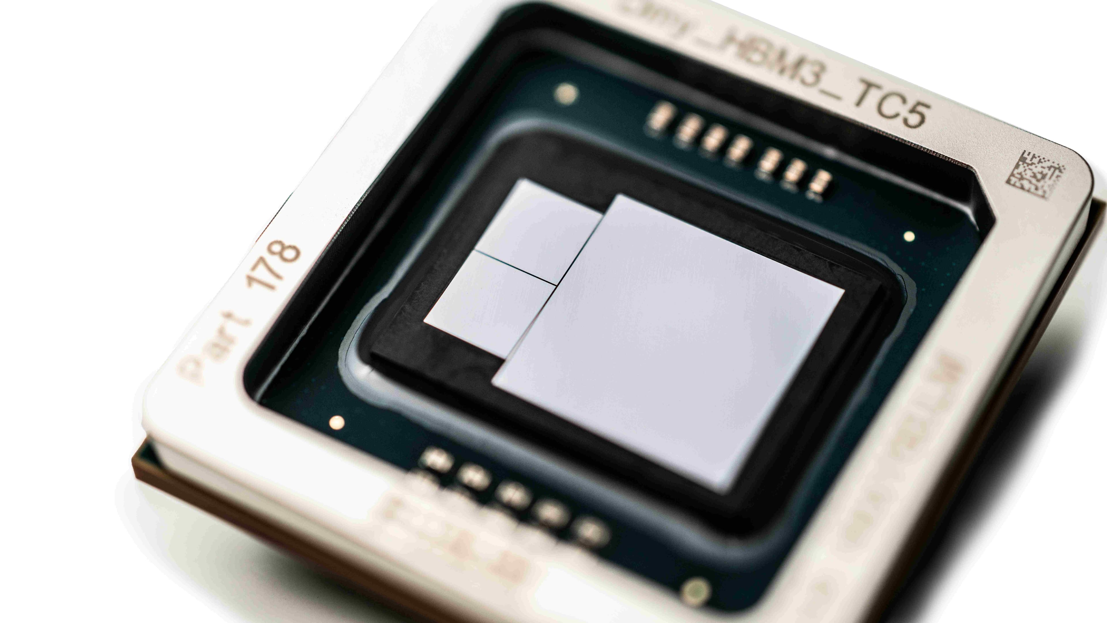 CoWoS%20imec Close-up of a chip package with a central die, illustrating advanced semiconductor packaging