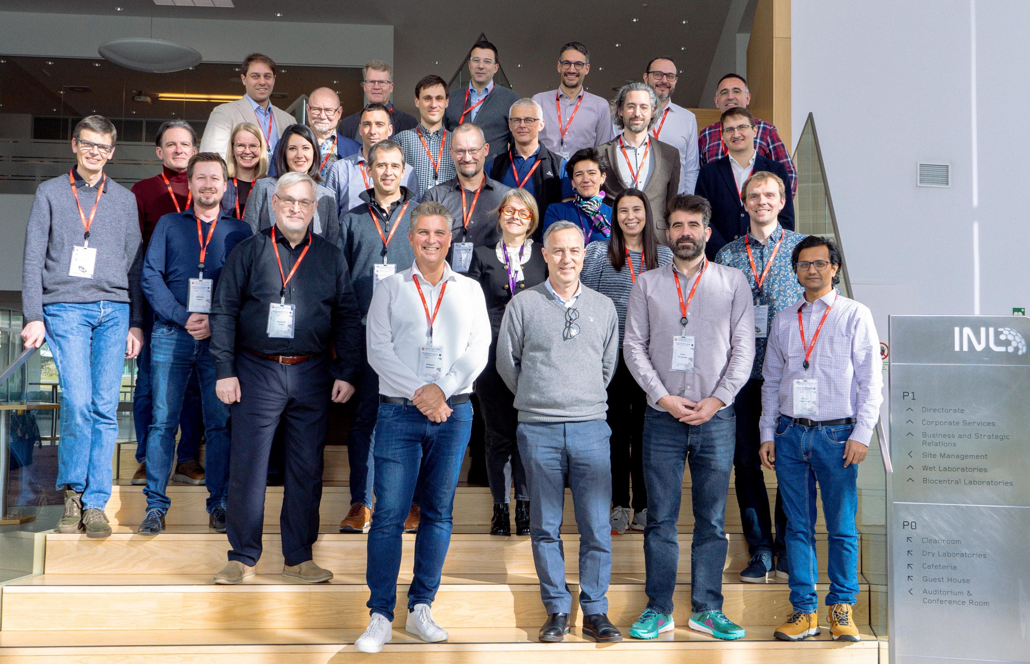 DECIDE%20%282%20of%204%29-header Group of consortium members posing on indoor steps at the International Iberian Nanotechnology Laboratory.