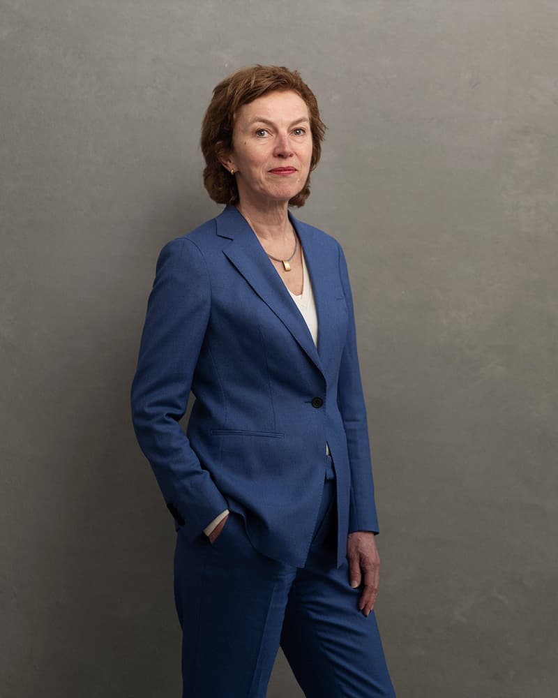 Dianda-Veldman Portrait of Dianda Veldman in a blue suit against a plain gray background