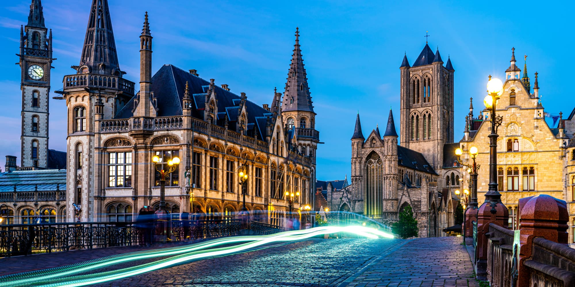 DISCO Historic city street at dusk with light trails suggesting fast urban deliveries