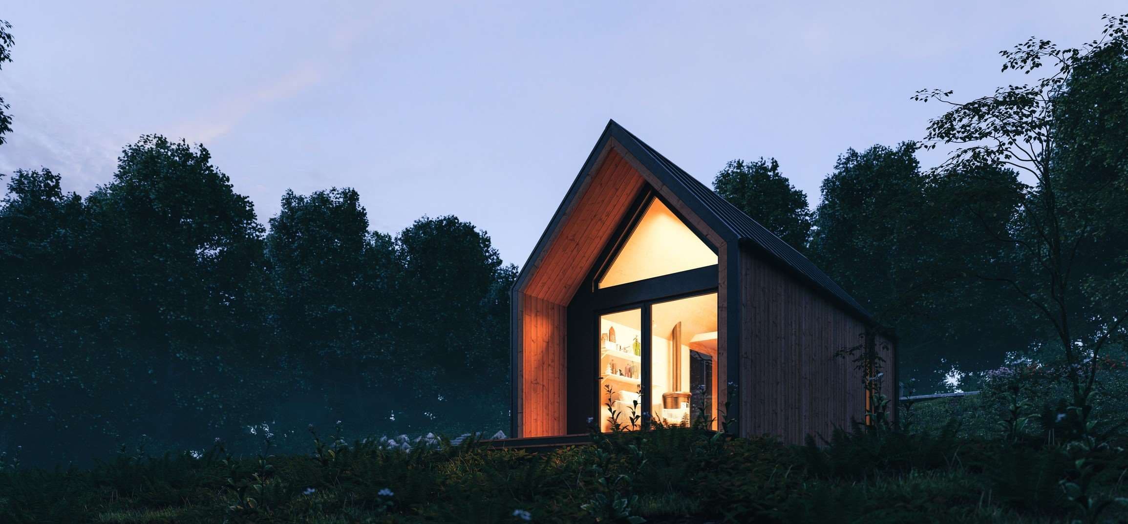 Energy%20technologies_header Small modern wooden house glowing at dusk among trees, suggesting a sustainable energy home