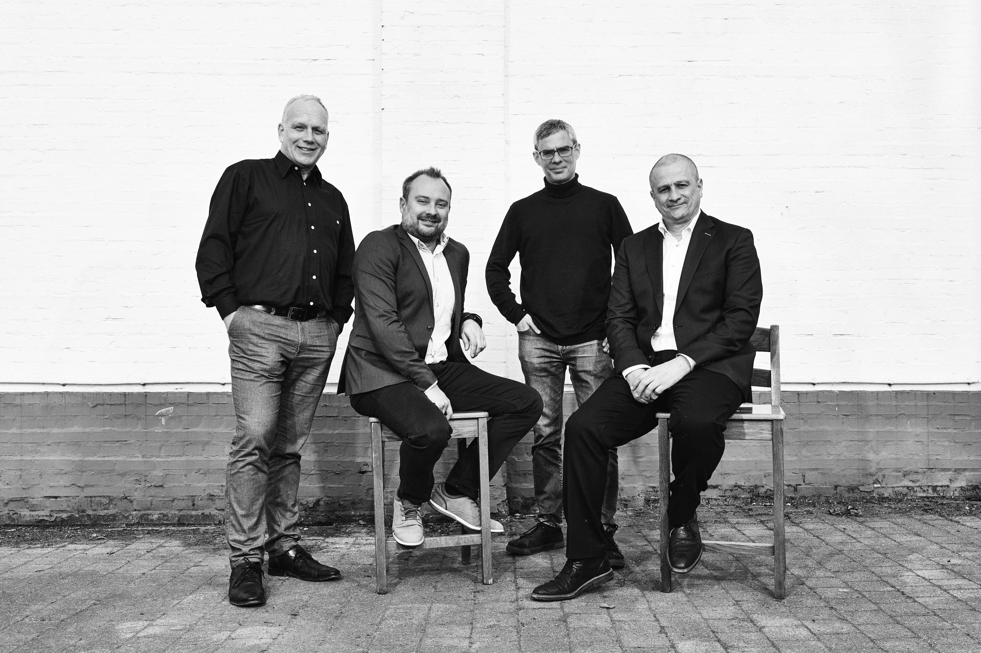 Eyeo%20Founders%20picture%20HD Four Eyeo founding team members posing against a white wall, with two seated on stools.