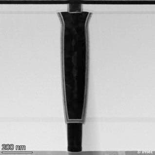 FeFET%20FeCAP%20image%201 Cross-sectional micrograph of a ferroelectric memory device structure with a central dark pillar and 200 nm scale bar.