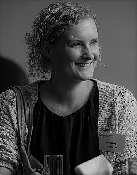 fien2_%28002%29_1 Black-and-white portrait of Fien Burg smiling, wearing a name badge.