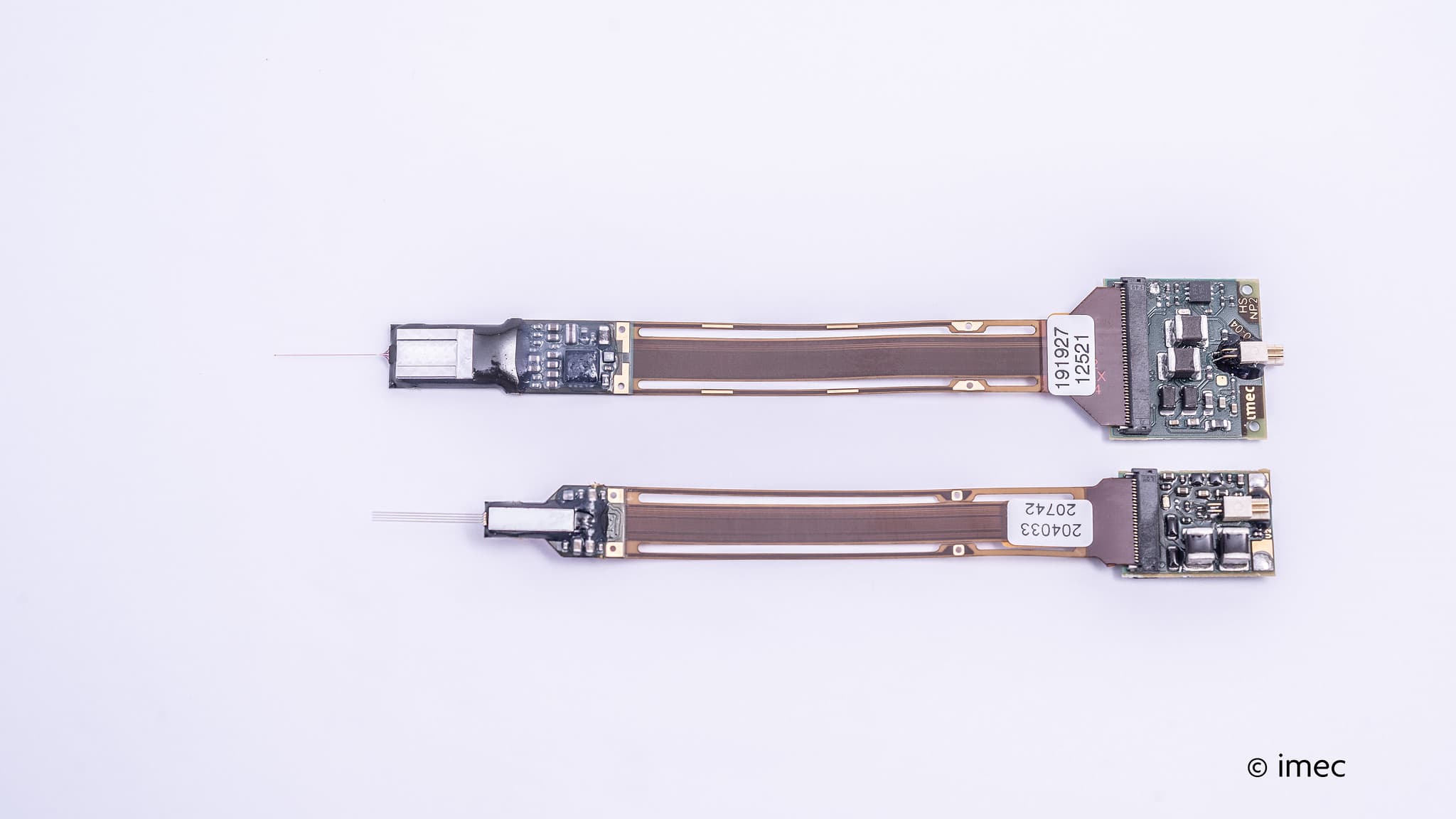 Comparison of two Neuropixels probe generations Two Neuropixels probes, showing a smaller new generation below the previous version