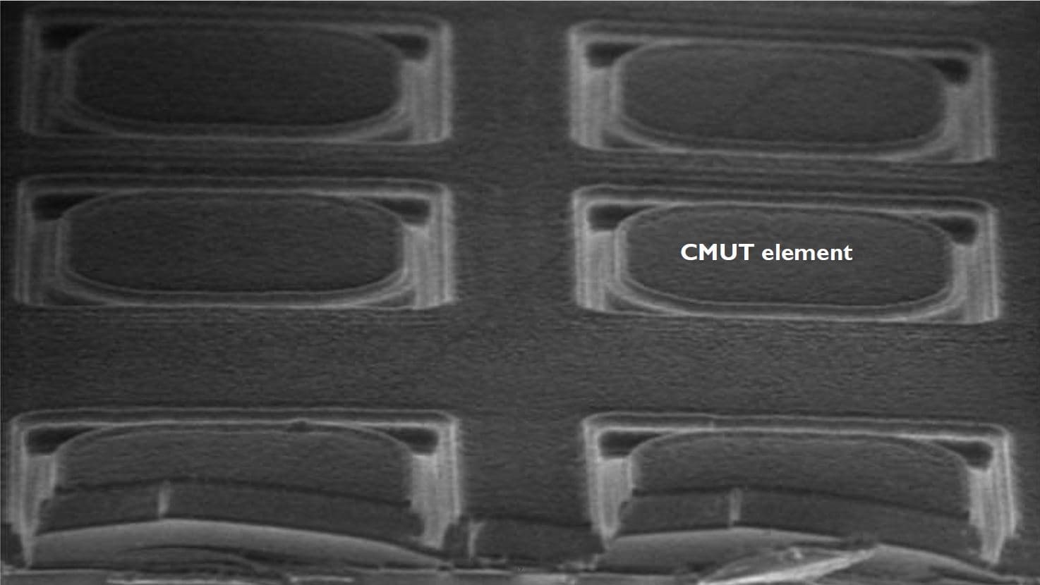 Close-up of micromachined CMUT cells in grid Micromachined CMUT cells arranged in a grid, shown as a grayscale close-up.