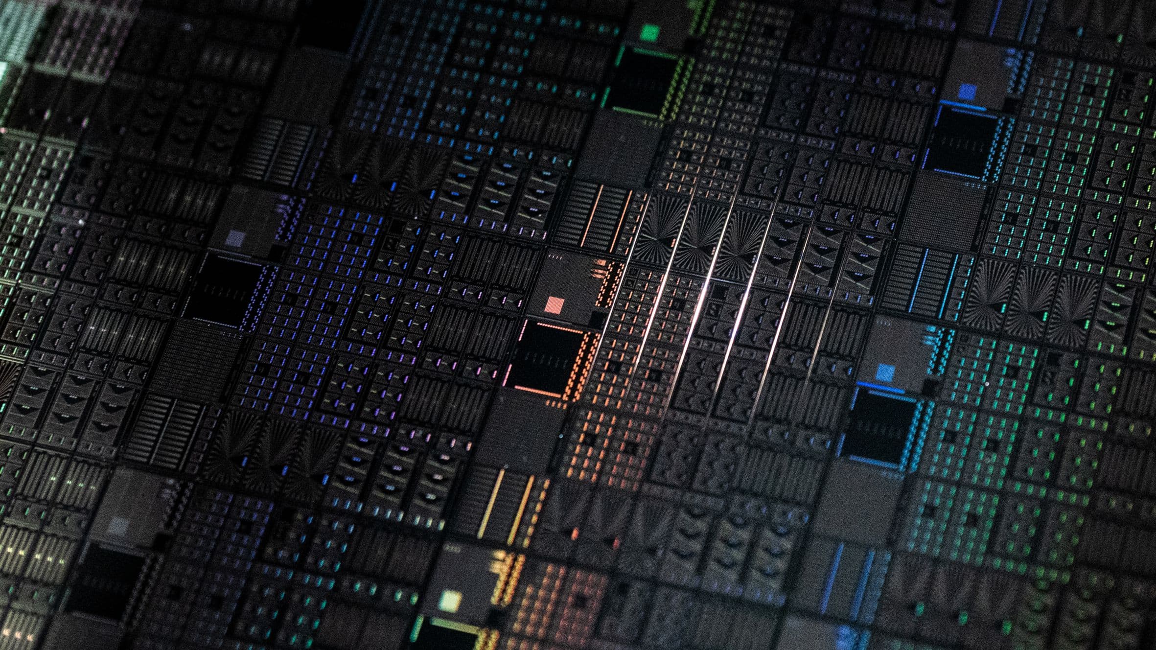 Close-up of patterned silicon wafer with quantum dot structures Close-up of a patterned silicon wafer with a dense array of quantum dot structures and colored contact lines