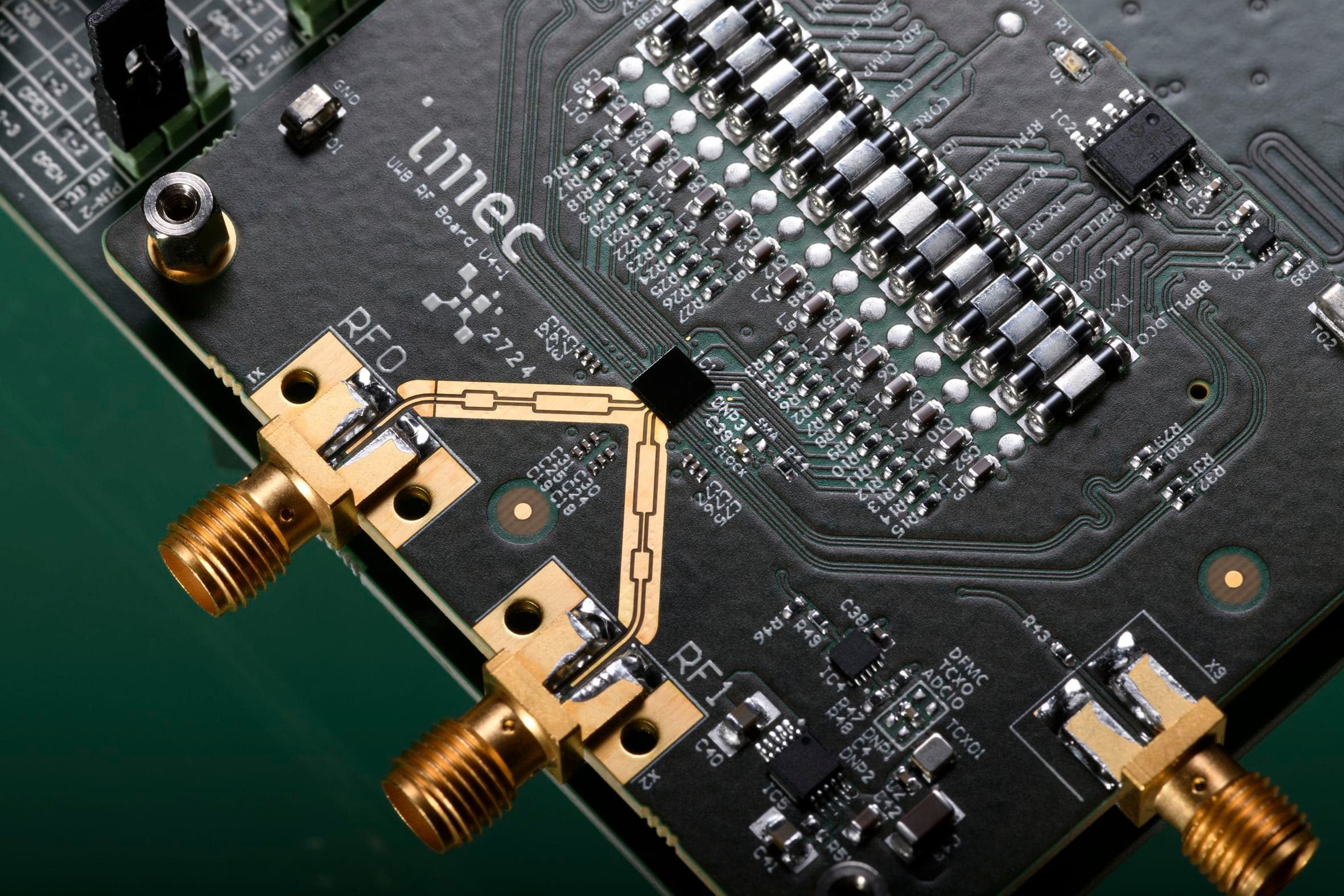 Figure%202%20-%20Photograph%20of%20imec%27s%20Gen-4%20UWB%20chip Imec Gen-4 IR-UWB radio board with gold RF connectors and surface-mounted components