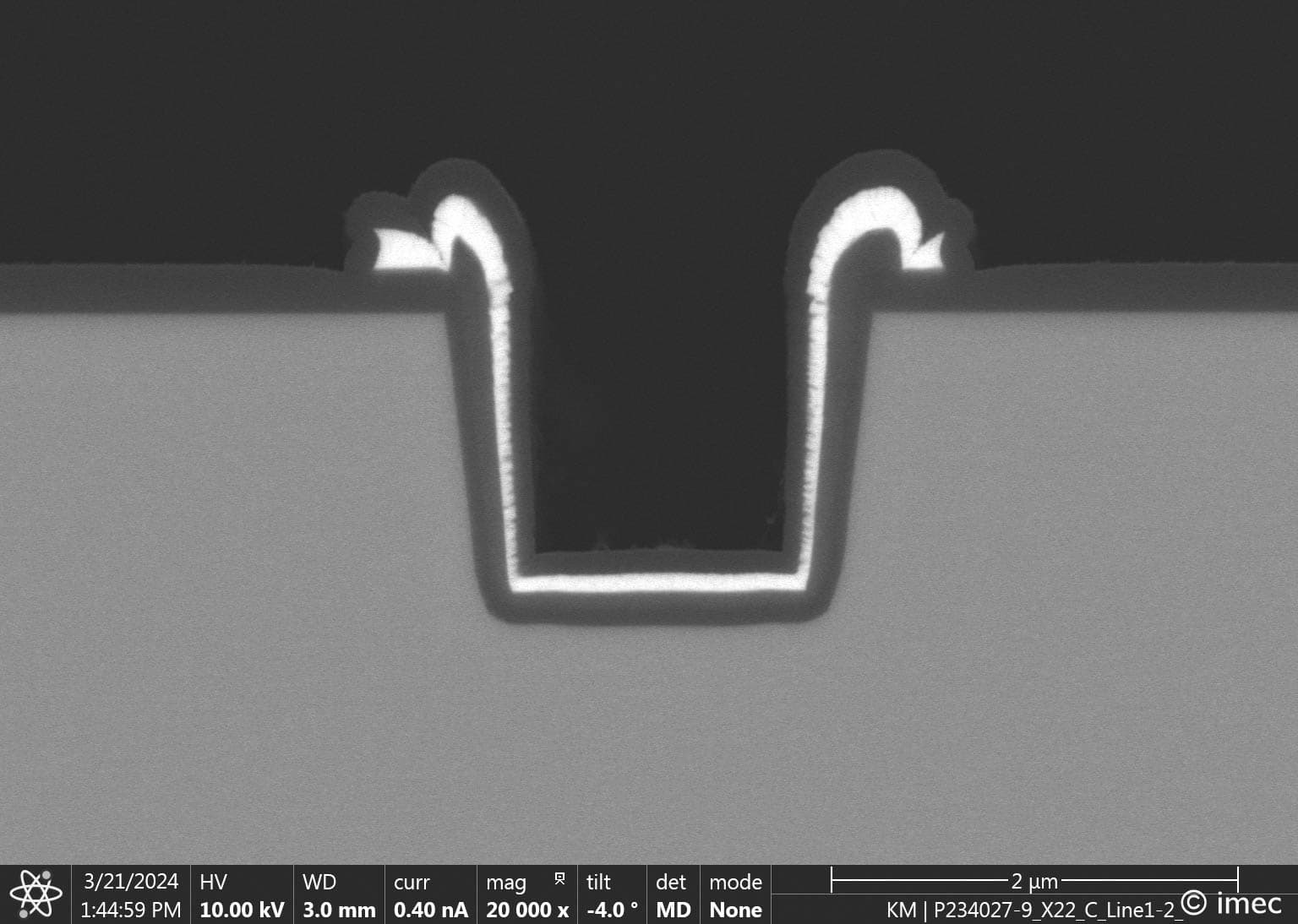 Figure%203%20-%20Trench%20gate%20vertical%20GaN%20FET Cross-section of a vertical GaN device with a trench-gate MOSFET structure under microscopic view.