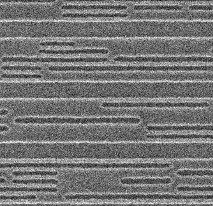 SEM image of Metal-2 logic pattern after retargeting SEM image of a metal-2 logic pattern with isolated and dense line features after lithography retargeting.