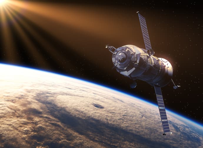 FrontGrade%20Gaisler%20testimonial Satellite orbiting above Earth with sunlight streaming in from the upper left