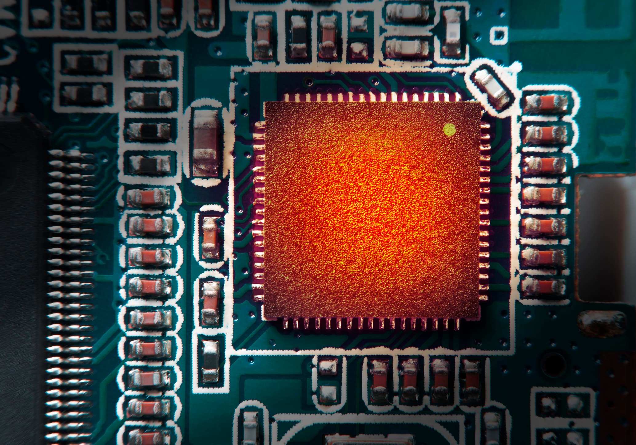 Close-up of microchip on circuit board Close-up of a microchip on a circuit board with surrounding electronic components