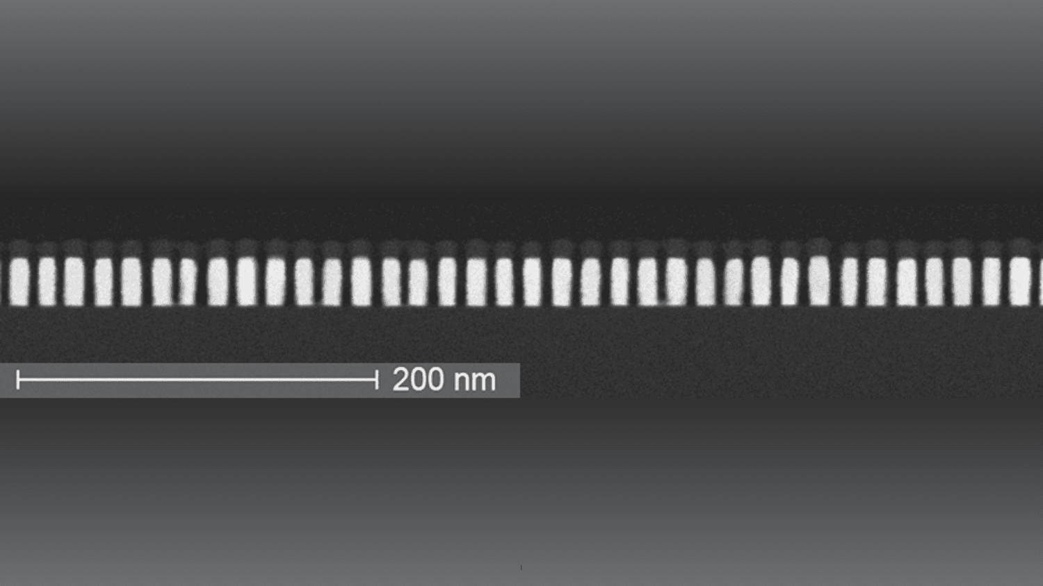 Scanning electron microscope image of Ru lines Scanning electron microscope image of tightly spaced Ru lines with a 200 nm scale bar