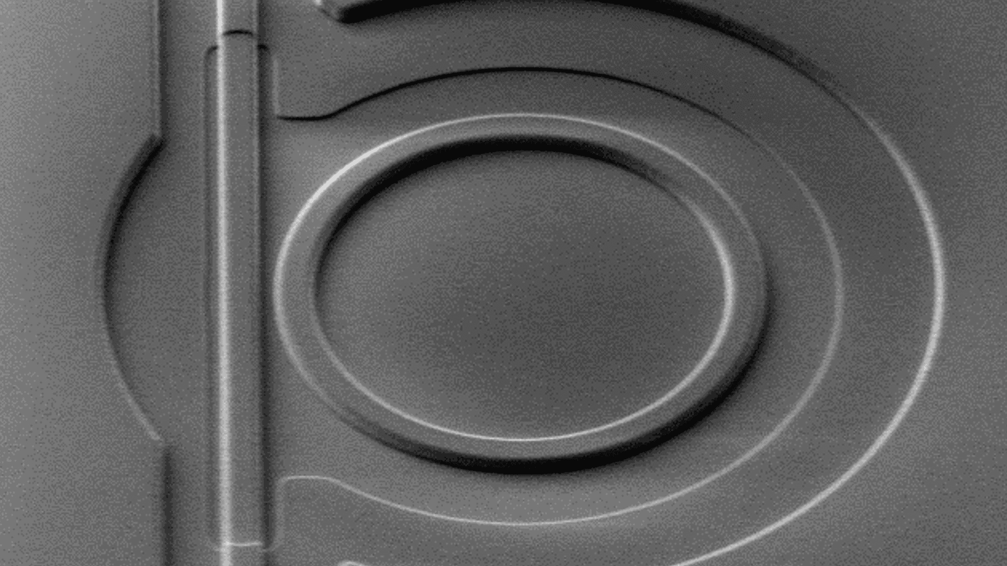 ultrasound sensor with concentric circles Close-up of an ultrasound transducer or sensor with concentric circular elements.