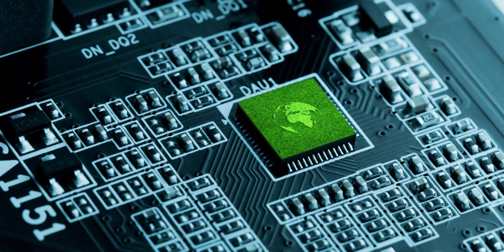 header-ssts Green microchip on a circuit board with white component markings