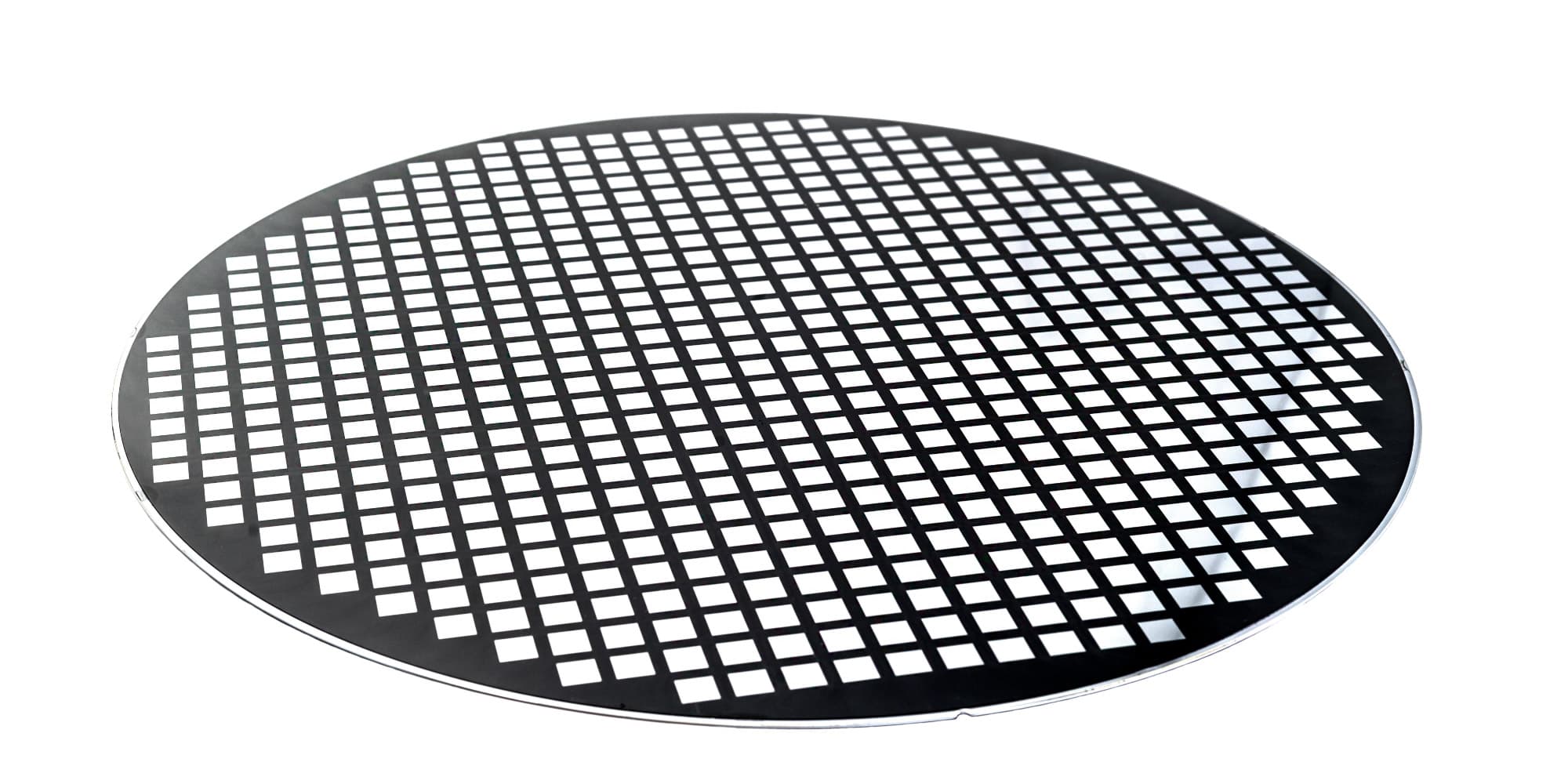 header_Temporarybondingmoldprocesstoenablenext-genfan-outwafer-levelpackaging Thinned reconstructed wafer with a grid of white rectangular die areas on a dark surface