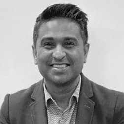 Hemanth%20Kaligotla Portrait of Hemanth Kaligotla smiling in a blazer and collared shirt