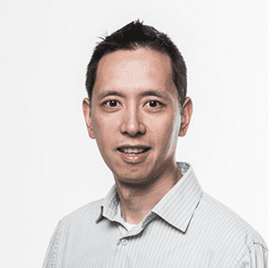 henry%20wong Portrait of Henry Wong in a light striped shirt against a white background