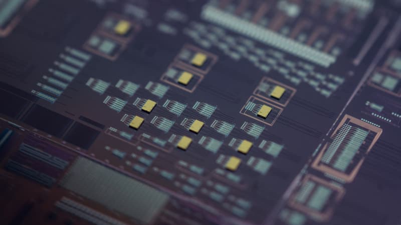 III-V-on-silicon%20lasers Silicon photonics chip with multiple yellow laser dies arranged across the surface