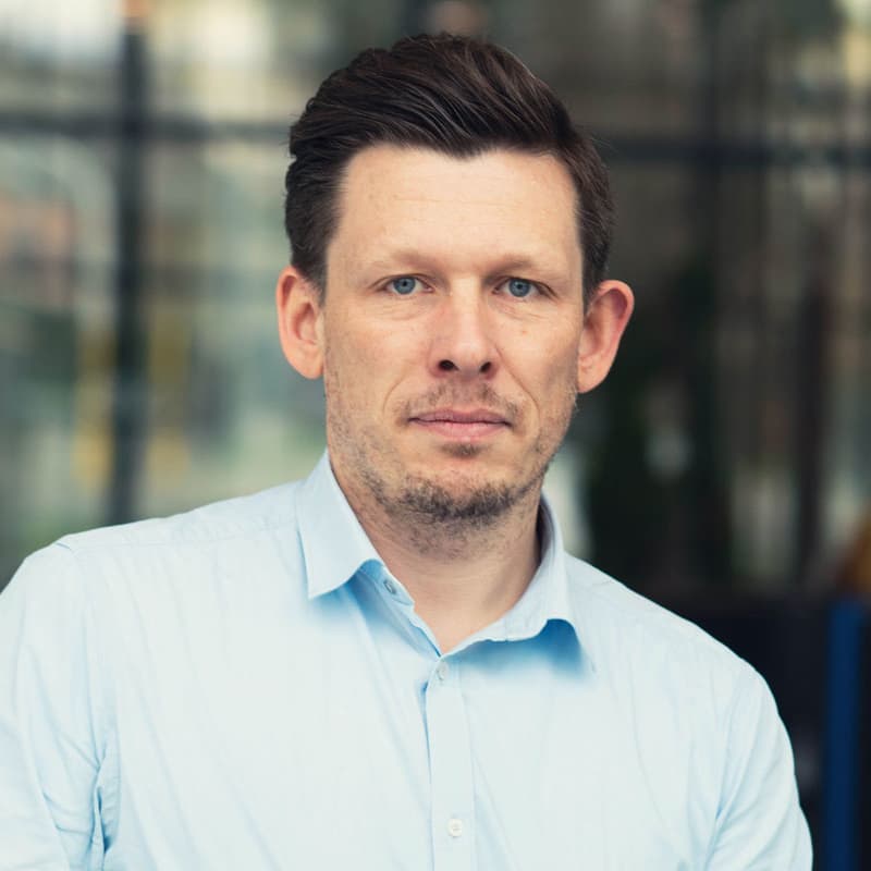 iljaocket Portrait of Ilja Ocket in a light blue shirt