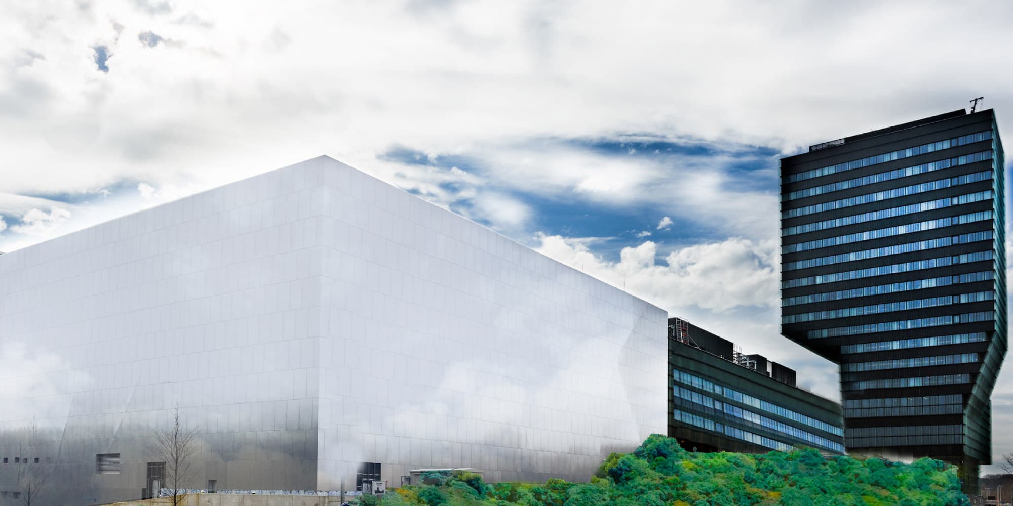 imec-cleanroom-tower-2016_1 Exterior view of imec’s cleanroom and lab buildings under a cloudy sky