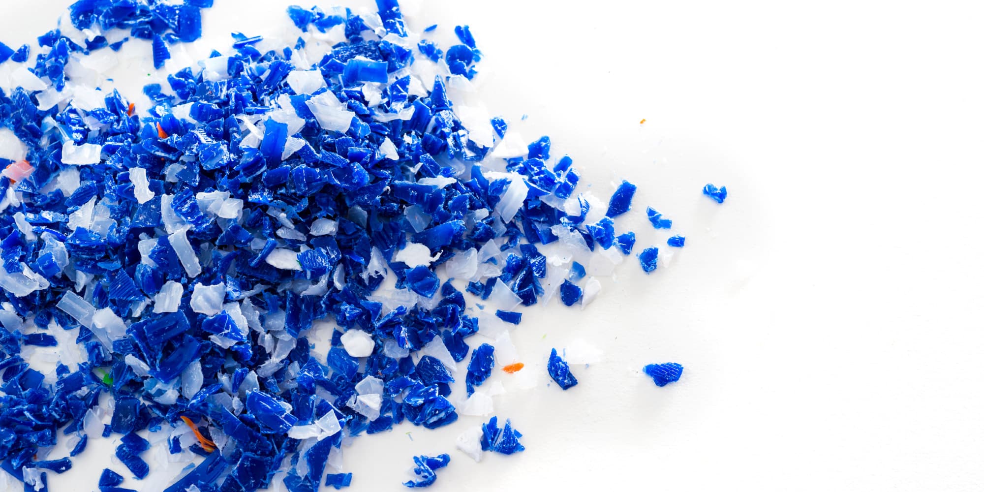 Imec-demonstrates-Shortwave-Infrared-SWIR-range-hyperspectral-imaging-camera_1 Blue and white plastic shards scattered across a white surface