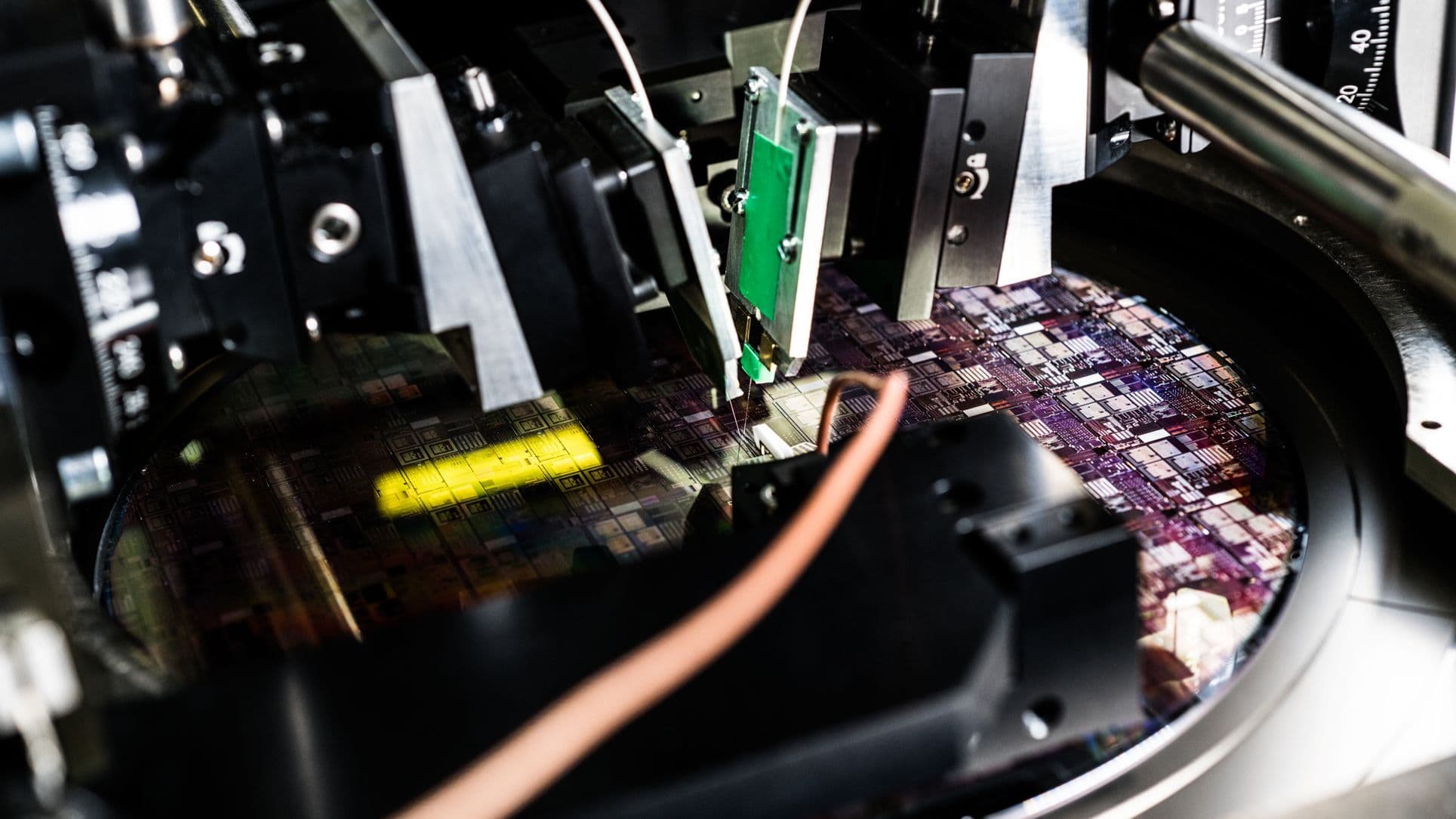 Imec-figure_5_-_photograph_of_the_test_station_FINAL_0 Wafer-level test station probing a silicon photonics wafer with optical and electrical manipulators