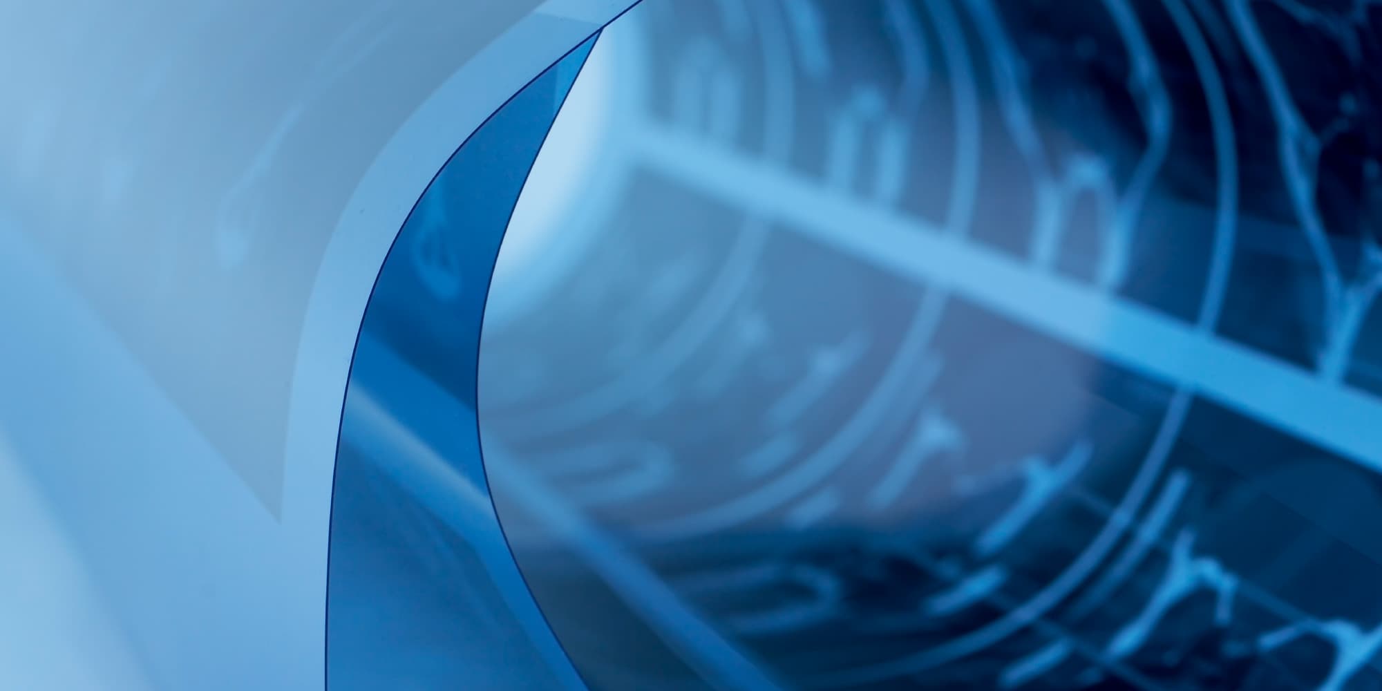 imec_life-sciences_medical-imaging_1 Abstract blue medical imaging equipment with a curved translucent panel and blurred tubing in the background