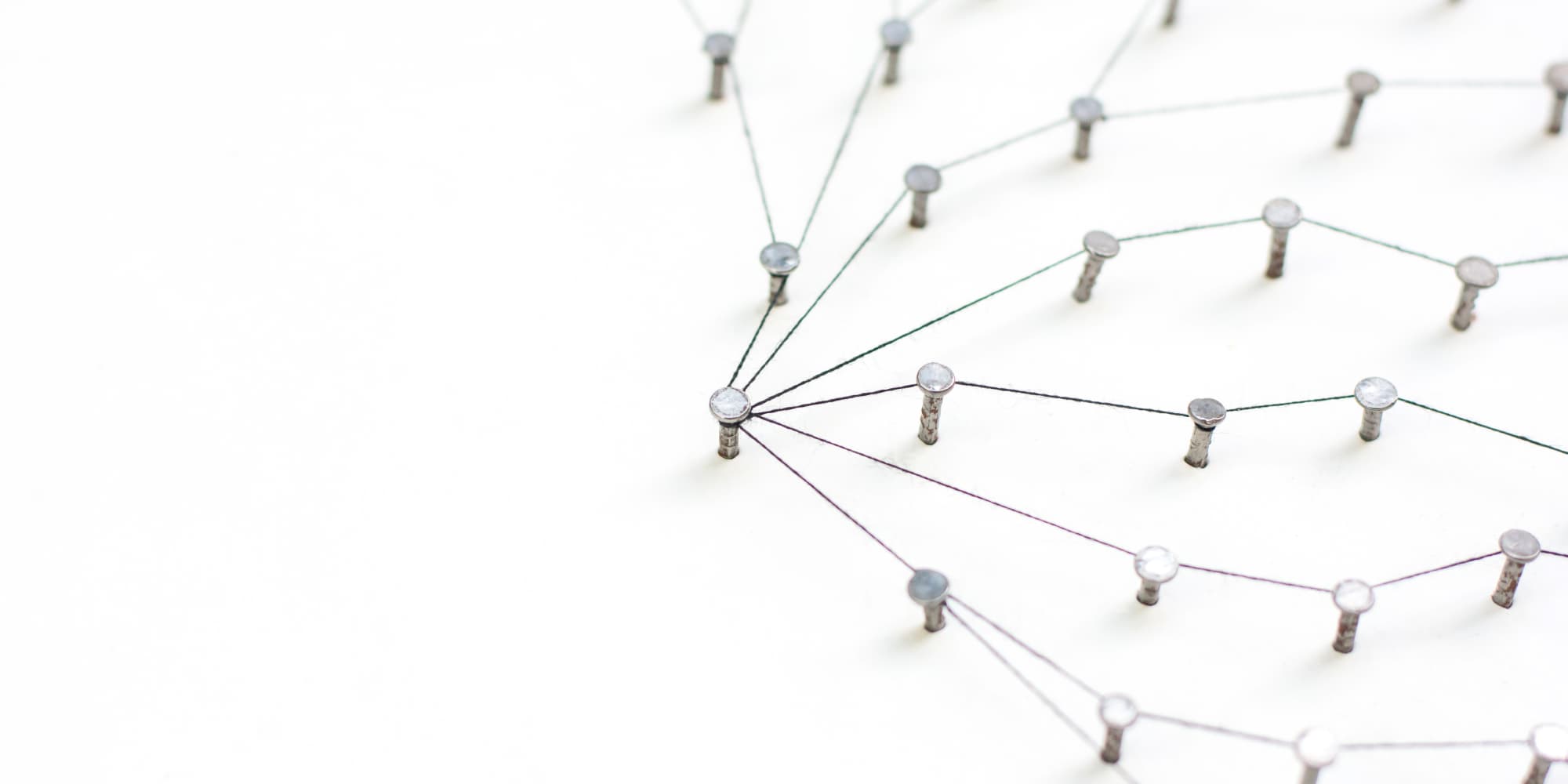 imec-magazine-10-forward_1 String-and-nail network diagram showing connected Wi‑Fi nodes on a white surface