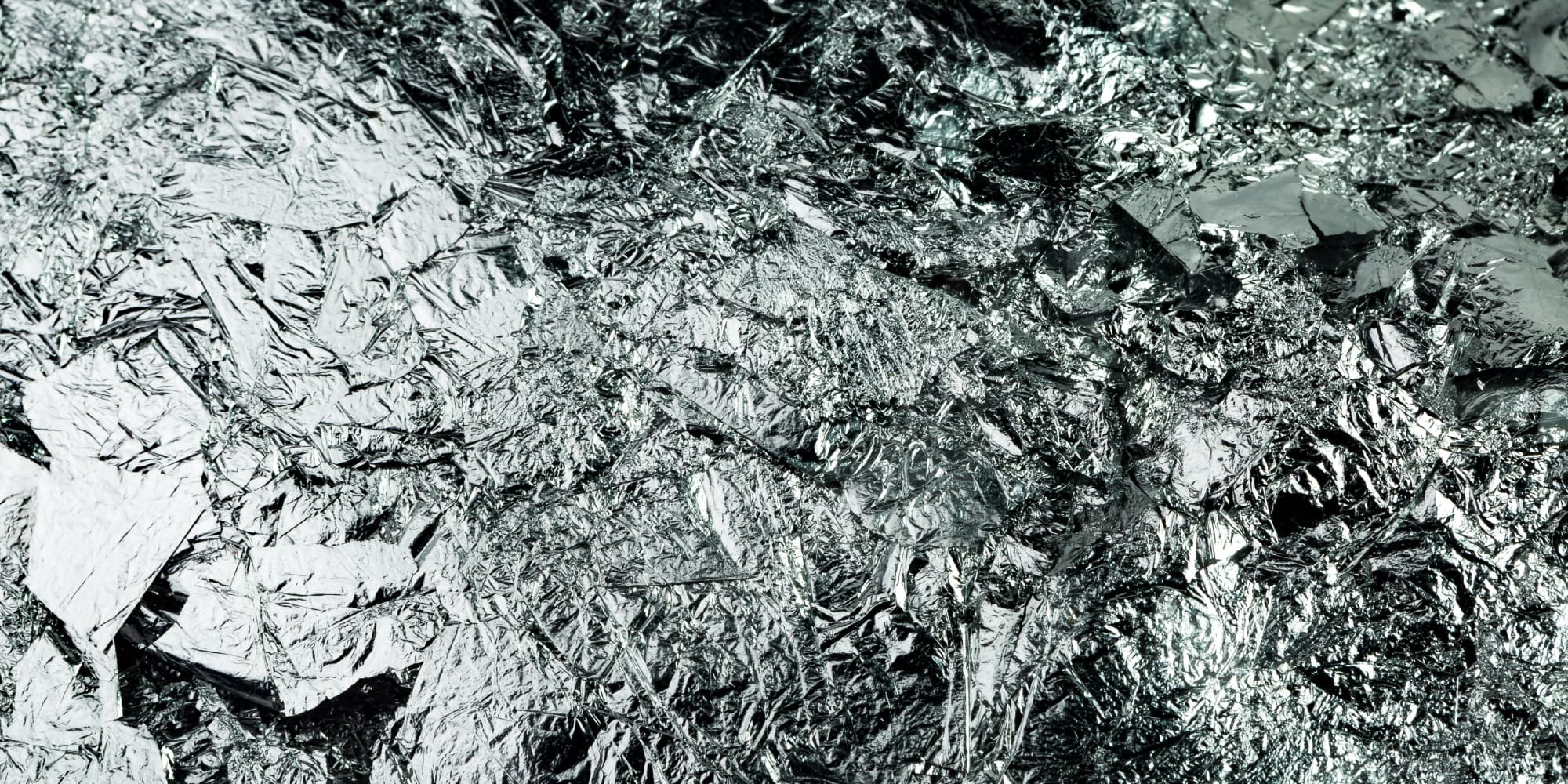 imec-magazine-7-contact-resistance_1 Close-up of crumpled metallic foil with a reflective, textured surface