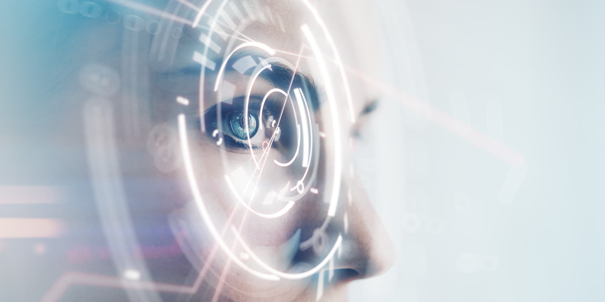 imec-magazine-ai-special-10_aria_1 Close-up of a person’s face with glowing AR-style recognition graphics over one eye