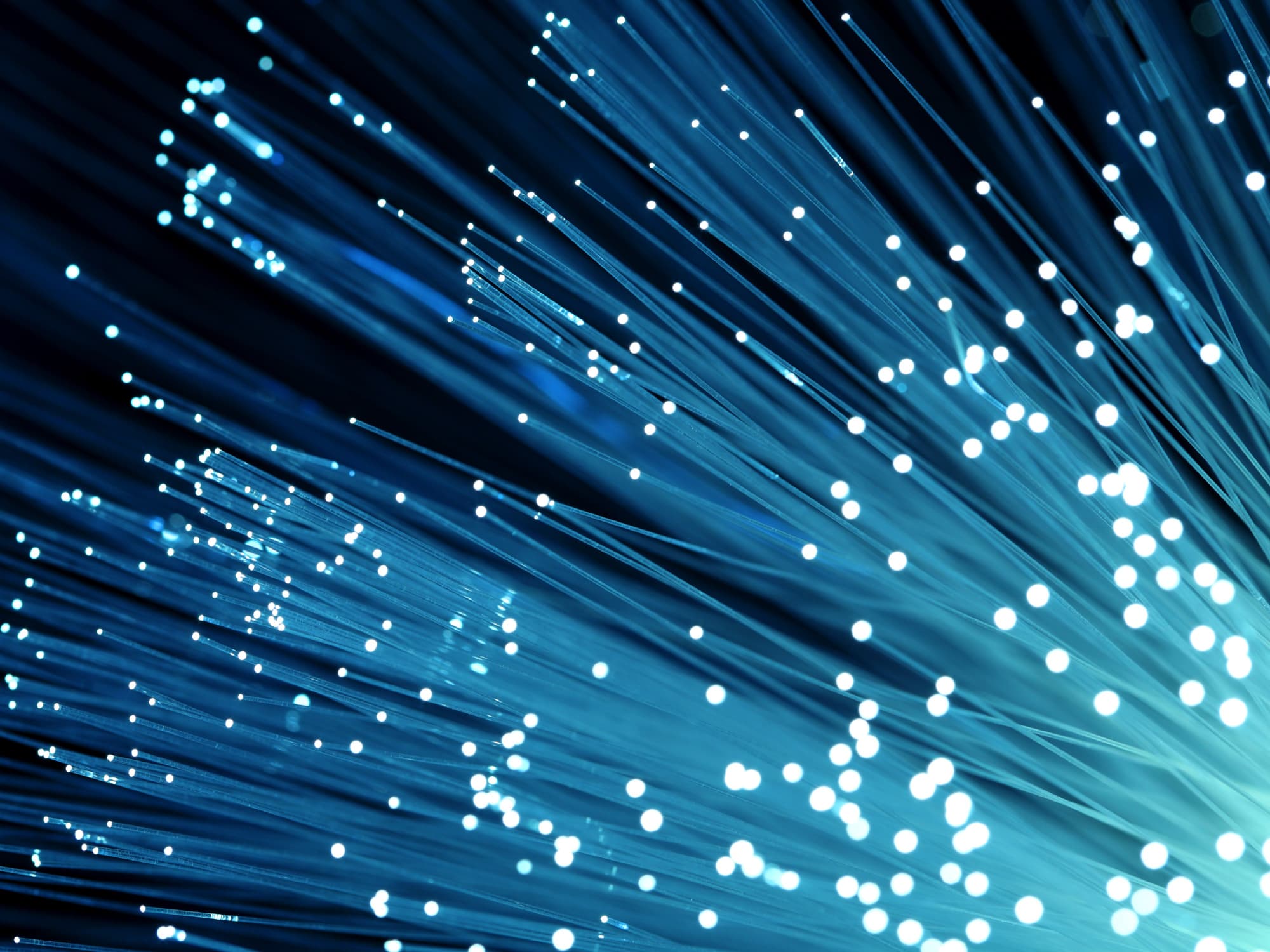 imec-magazine-biophotonics_1 Abstract blue optical fibers with glowing light points streaming diagonally