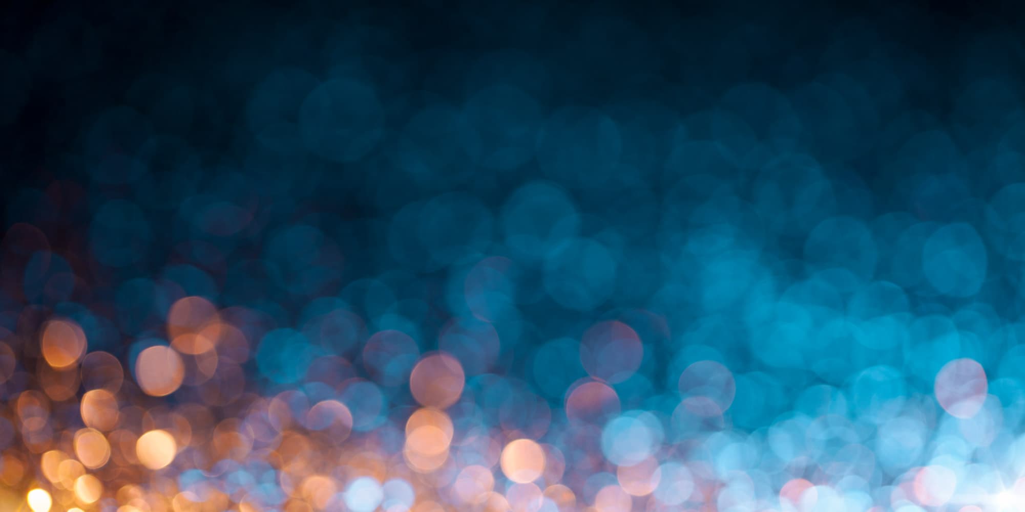 imec-magazine-centered6_1 Abstract blue and orange bokeh lights on a dark background